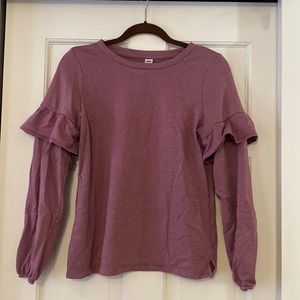 Mauve sweatshirt with ruffled detail on sleeves.